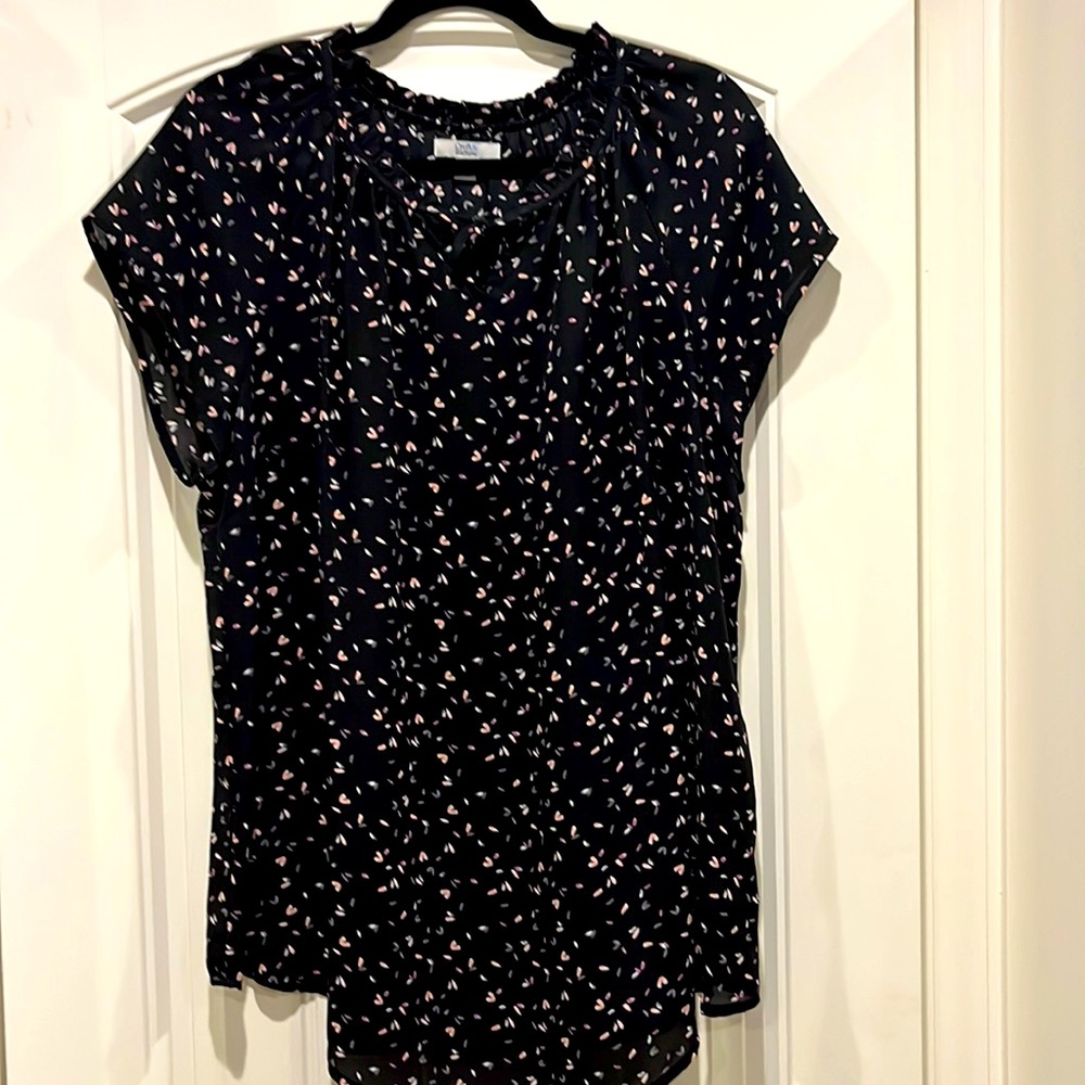 Thin, comfy sleeveless ruffle neck knit top